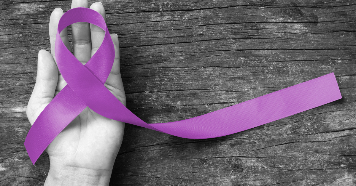 A grayscale image shows a hand to the left, with the palm up. On top of the hand is purple ribbon, looped over itself, with the excess ribbon lying across the right of the image.