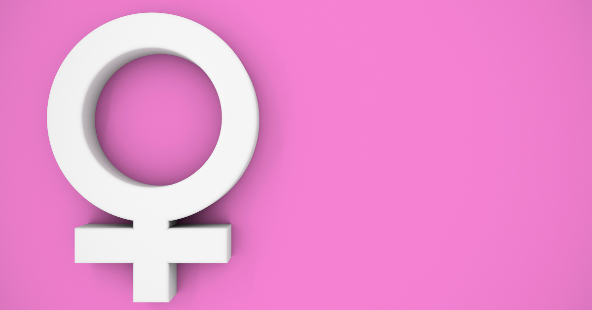 A white 3D female symbol sits at the left of the image, against a pink background.