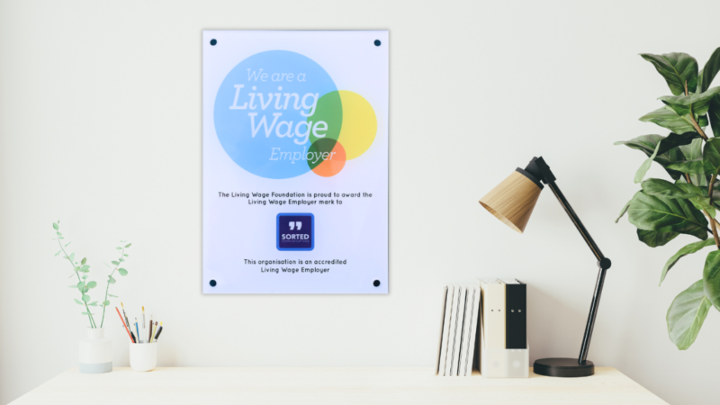 Living Wage sign on wall