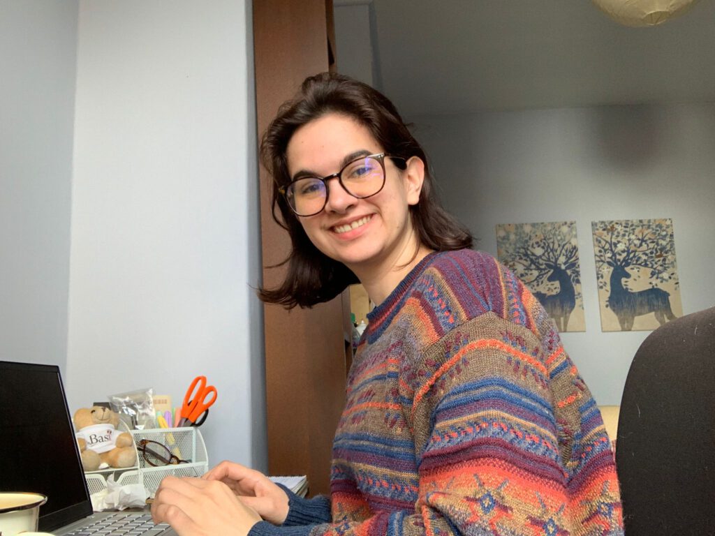 Laura smiling at desk