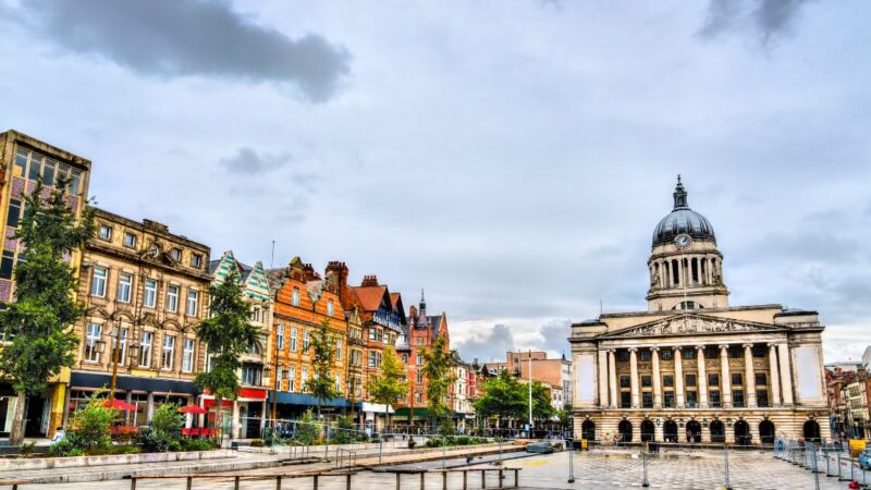 A landscape photo of Old Market Square in Nottingham, with Nottingham Town Hall in the background.