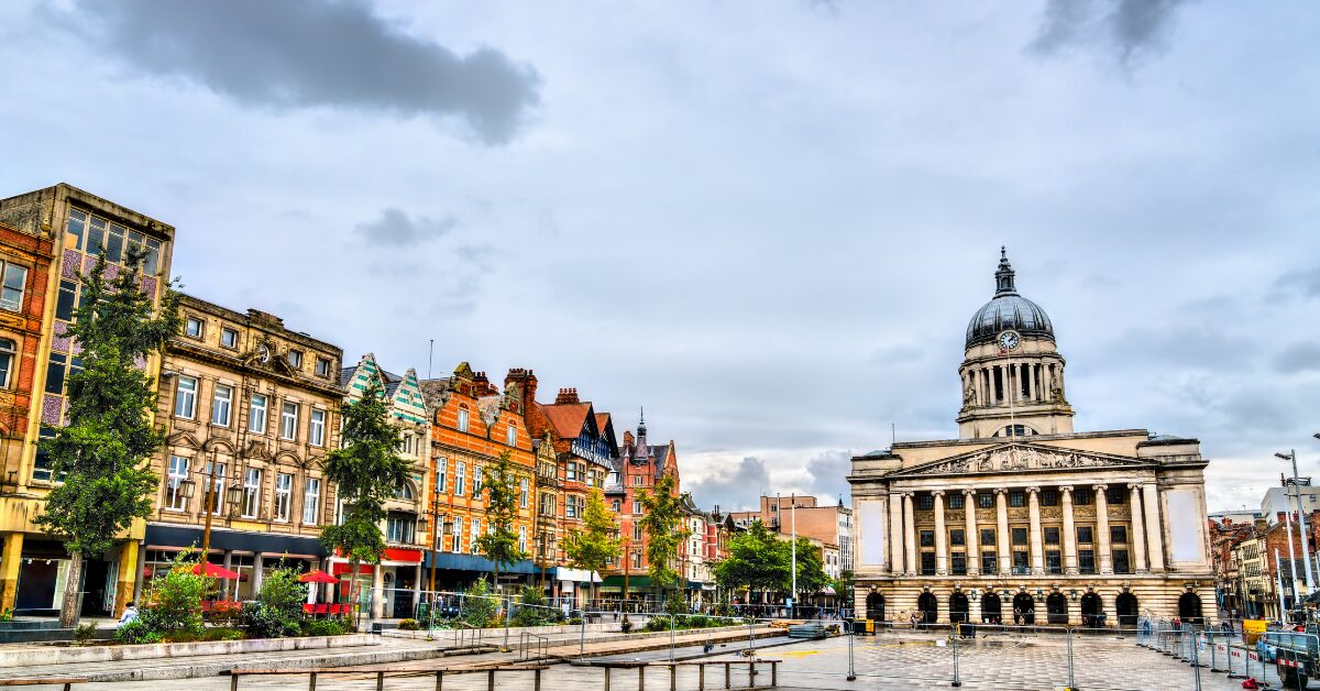 A landscape photo of Old Market Square in Nottingham, with Nottingham Town Hall in the background.